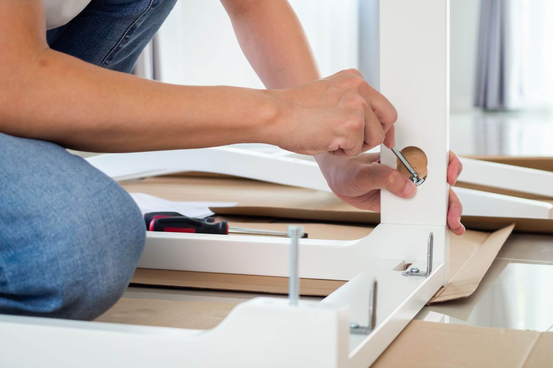man-assembling-white-chair-furniture-home.jpg